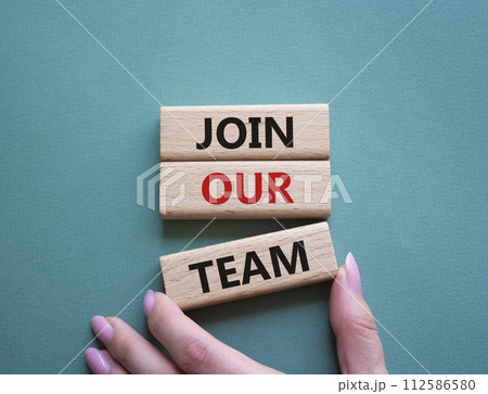 Join our team symbol. Wooden blocks with words Join our team. Beautiful grey green background. Businessman hand. Business and Join our team concept. Copy space. 112586580