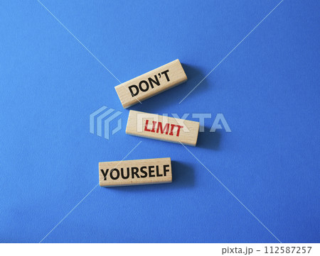 Do not limit yourself symbol. Concept words Do not limit yourself on wooden blocks. Beautiful blue background. Business and Do not limit yourself concept. Copy space Do not limit yourself symbol. Concept words Do not limit yourself on wooden blocks. Beautiful blue background. Business and Do not limit yourself concept. Copy space 112587257