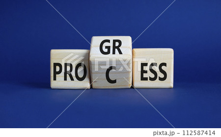 Process and Progress symbol. Wooden cubes with words Process and Progress. Beautiful deep blue background. Business and Process and Progress concept. Copy space Process and Progress symbol. Wooden cubes with words Process and Progress. Beautiful deep blue background. Business and Process and Progress concept. Copy space 112587414