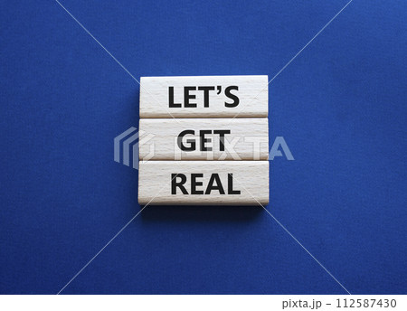 Lets get real symbol. Concept words Lets get real on wooden blocks. Beautiful deep blue background. Business and Lets get real concept. Copy space. Lets get real symbol. Concept words Lets get real on wooden blocks. Beautiful deep blue background. Business and Lets get real concept. Copy space. 112587430
