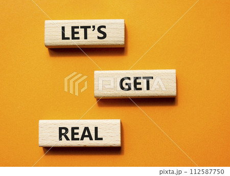 Lets get real symbol. Concept words Lets get real on wooden blocks. Beautiful orange background. Business and Lets get real concept. Copy space. Lets get real symbol. Concept words Lets get real on wooden blocks. Beautiful orange background. Business and Lets get real concept. Copy space. 112587750