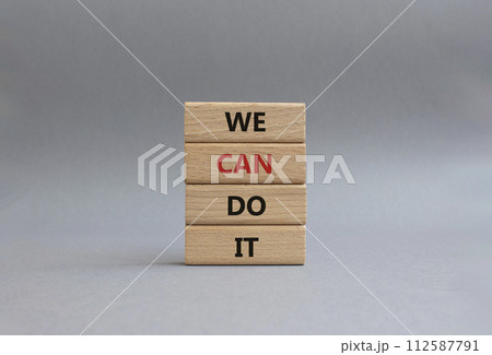 We can do it symbol. Concept words We can do it on wooden blocks. Beautiful grey background. Business and We can do it concept. Copy space. We can do it symbol. Concept words We can do it on wooden blocks. Beautiful grey background. Business and We can do it concept. Copy space. 112587791