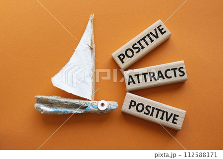 Positive attracts Positive symbol. Wooden blocks with words Positive attracts Positive. Beautiful orange background with boat. Business and Positive attracts Positive concept. Copy space. Positive attracts Positive symbol. Wooden blocks with words Positive attracts Positive. Beautiful orange background with boat. Business and Positive attracts Positive concept. Copy space. 112588171