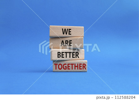 We are better together symbol. Wooden blocks with words We are better together. Beautiful blue background. We are better together concept. Copy space. We are better together symbol. Wooden blocks with words We are better together. Beautiful blue background. We are better together concept. Copy space. 112588204