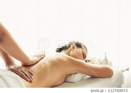 Caucasian woman customer enjoying relaxing anti-stress massage. Quiescent 112588653