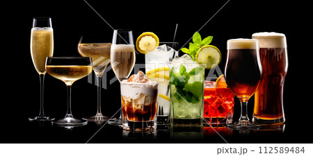 Set and collection of classic alcohol cocktails or mocktail isolated on black background with fresh summer fruits 112589484