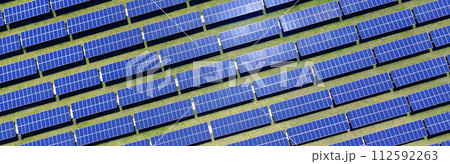 Blue solar panels. Alternative green clean source of energy. Aerial view. Long banner. 112592263