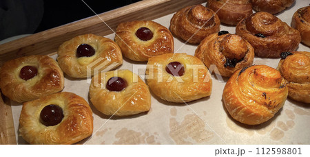 freshly baked danish pastry with apricot jam fruity jelly super delicious warm fresh buttery baked pastries with apricot and peach 112598801