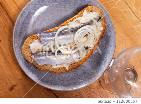 Sandwich with herring fish and butter 112600357