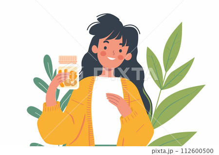 サプリメントのボトルを持っている若い女性 112600500