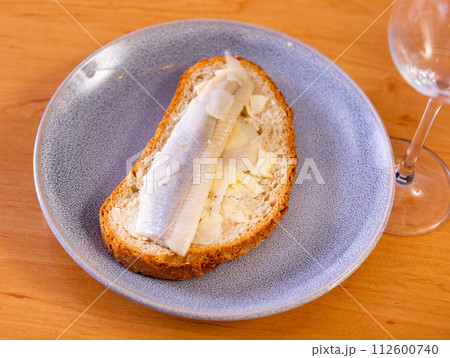 Sandwich with herring fish and butter 112600740