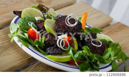 Appetizing black pudding with rice Appetizing black pudding with rice 112600886