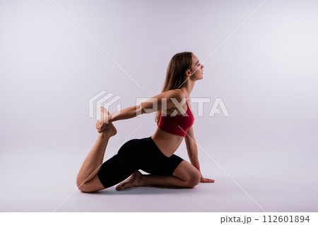 Beautiful female in yoga studio. A woman doing a yoga. Lady in a top. 112601894