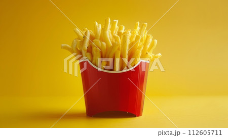 Close up of French fries or potato chips for advertisement of commercial on yellow background. 112605711