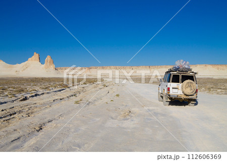 Offroad vehicle in Bozzhira valley, adventure travel, Kazakhstan Offroad vehicle in Bozzhira valley, adventure travel, Kazakhstan 112606369