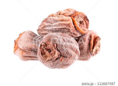 Dried persimmon isolated on white background. Dried fruit snack. Dried persimmon isolated on white background. Dried fruit snack. 112607397