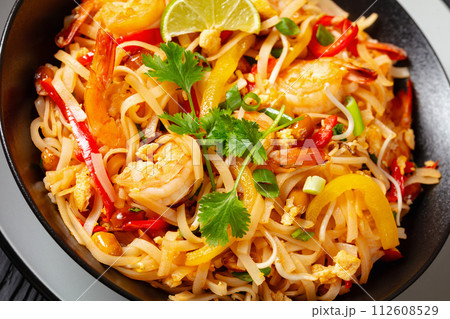 pad thai with shrimps, peanuts, eggs, bean sprouts pad thai with shrimps, peanuts, eggs, bean sprouts 112608529