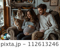 Expecting couple enjoying cozy moment at home Expecting couple enjoying cozy moment at home 112613246