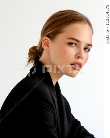 Fashionable girl in black classic suit in studio Fashionable girl in black classic suit in studio 112614378