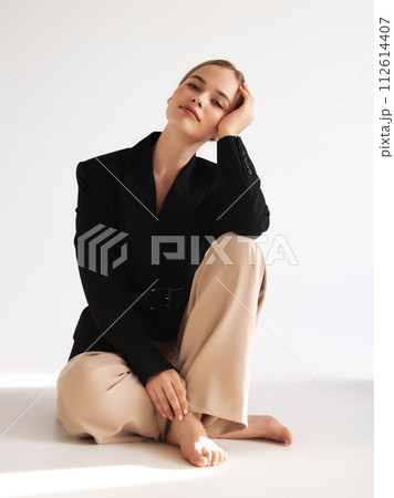 Fashionable confident woman wearing elegant white Fashionable confident woman wearing elegant white 112614407