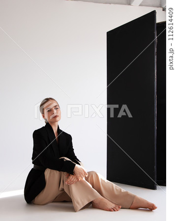 Fashionable confident woman wearing elegant white 112614409