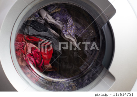 a close view of domestic washing machine at work 112614751