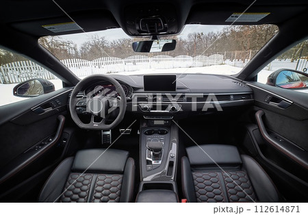 Inside moden car background, luxury car interior elements wallpaper. Black leather car interior Inside moden car background, luxury car interior elements wallpaper. Black leather car interior 112614871