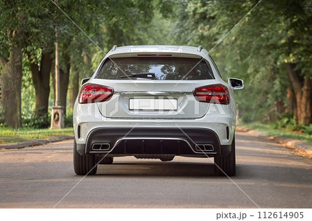 Modern white car driving in the country side background, luxury city car wallpaper Modern white car driving in the country side background, luxury city car wallpaper 112614905