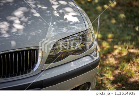 White car with a street background. Modern city car photo 112614938