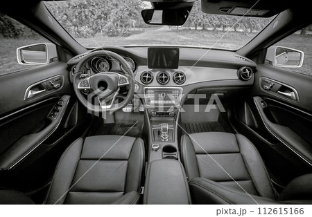 Inside moden car background, luxury car interior elements wallpaper. Black leather car interior Inside moden car background, luxury car interior elements wallpaper. Black leather car interior 112615166