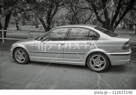 White car with a street background. Modern city car photo 112615190