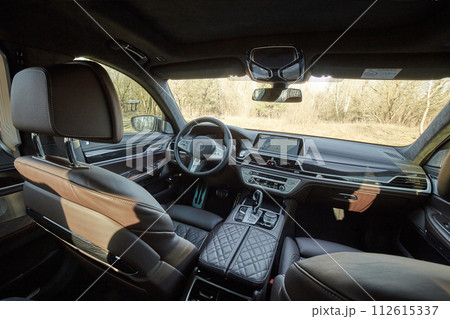 Inside moden car background, luxury car interior elements wallpaper. Black leather car interior Inside moden car background, luxury car interior elements wallpaper. Black leather car interior 112615337