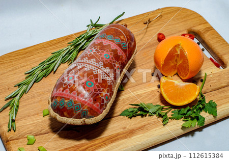 Tasty sausages and vegetables isolated over solid background Tasty sausages and vegetables isolated over solid background 112615384