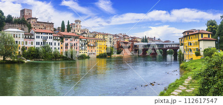 Beautiful medieval towns of Italy -picturesque Bassano del Grappa .Scenic view with famous bridge. Vicenza province, region of Veneto. Beautiful medieval towns of Italy -picturesque Bassano del Grappa .Scenic view with famous bridge. Vicenza province, region of Veneto. 112617547