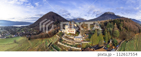 Most beautiful medieval castles of France - fairytale Menthon located near lake Annecy. aerial panoramic view. 112617554