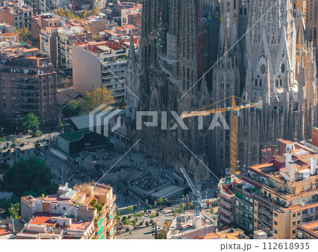 Aerial view of Barcelona City Skyline and Sagrada Familia Cathedral at sunset. Residential famous urban grid of Catalonia. Beautiful panorama of Barcelona. Aerial view of Barcelona City Skyline and Sagrada Familia Cathedral at sunset. Residential famous urban grid of Catalonia. Beautiful panorama of Barcelona. 112618935