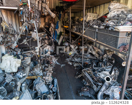 freight container filled with used car parts on junkyard shop freight container filled with used car parts on junkyard shop 112624328