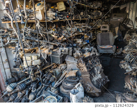 freight container filled with used car parts on junkyard shop freight container filled with used car parts on junkyard shop 112624329