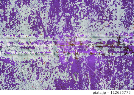 purple steel sheet wall with peeled off white paint under direct sunlight, full-frame background and texture 112625773