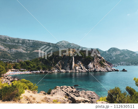 Top view Montenegro Sutomore stones beach blue turquoise Adriatic sea water mountains day 112630511