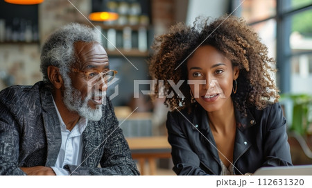 Man Sitting at Table Talking to Woman Man Sitting at Table Talking to Woman 112631320