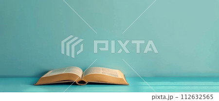 Open Book on Table 112632565