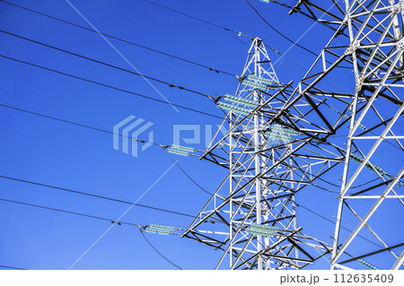 High voltage tower against the sky. Power transmission tower with wires 112635409