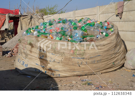 9th of March, 2024. Lahore, Punjab, Pakistan: Pile of plastic bottles collected in a big garbage bag. Concept of recycling. 9th of March, 2024. Lahore, Punjab, Pakistan: Pile of plastic bottles collected in a big garbage bag. Concept of recycling. 112638348