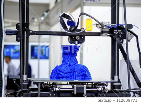 The process of printing an object with 3D printer. 3D printer printing a model from molten plastic. 3D printing. Robotic creation of mold form. Automated creation prototyping of 3D printers technology The process of printing an object with 3D printer. 3D printer printing a model from molten plastic. 3D printing. Robotic creation of mold form. Automated creation prototyping of 3D printers technology 112638773