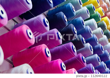 Assorted spools of multi-coloured cotton threads Assorted spools of multi-coloured cotton threads 112640122