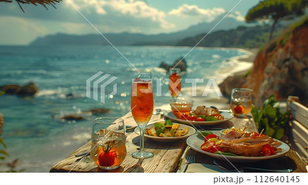 Illustration of delicious looking food beautifully arranged on a beach by the sea. Can be used to attract tourists, promote seaside restaurants, food products, catering services or travel packages 112640145