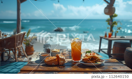 Illustration of delicious looking food beautifully arranged on a beach by the sea. Can be used to attract tourists, promote seaside restaurants, food products, catering services or travel packages Illustration of delicious looking food beautifully arranged on a beach by the sea. Can be used to attract tourists, promote seaside restaurants, food products, catering services or travel packages 112640150
