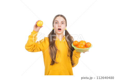 cheerful kid with citrus fruit lemon full of vitamins isolated on white, detox 112640480