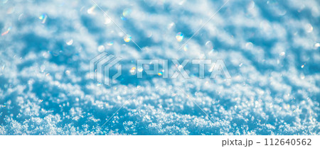 banner Natural snow background, snow glitters and shimmers like a rainbow in the sun, natural snow texture 112640562
